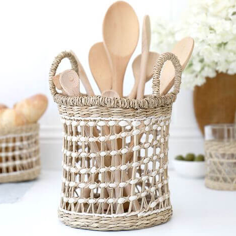 Round handwoven Seagrass Open-Weave Utensil Holder caddy in natural seagrass offers a warm, inviting vibe to your breakfast bar or countertop.