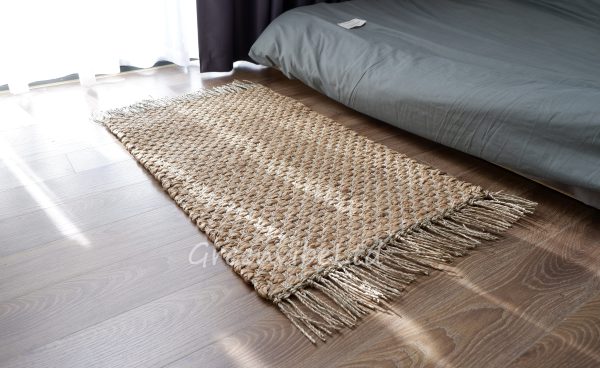 A minimalist Rectangular Wicker Rug is made of seagrass and water hyacinth, two natural and durable materials.