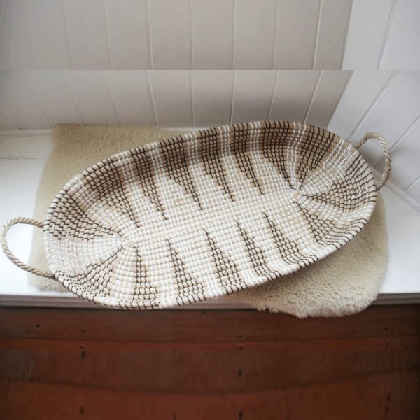 The special combination of two opposing colors makes this Woven seagrass baby basket stand out. Made of seagrass - natural material