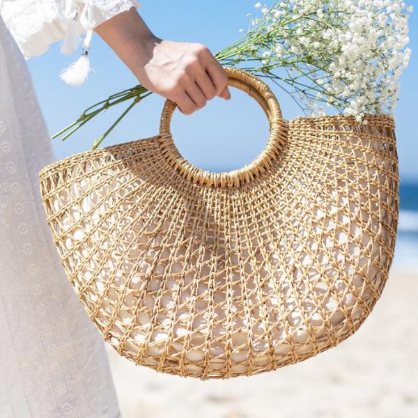 Check out our Half Moon Seagrass Handbag, handwoven from skilled Vietnamese artisans, perfect for a picnic!