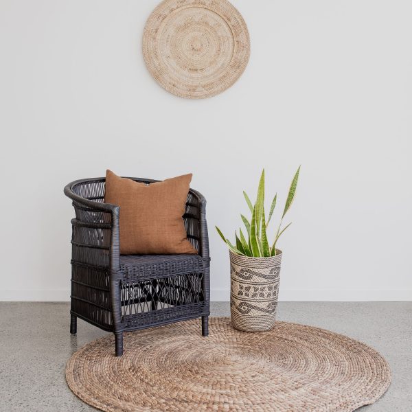 This warm, natural water hyacinth area rice nut weave rug is a wonderful vintage touch for your green living space.