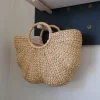 Wear this handwoven Hyacinth Handbag for a simple and elegant look this season as an everyday bag of for events.